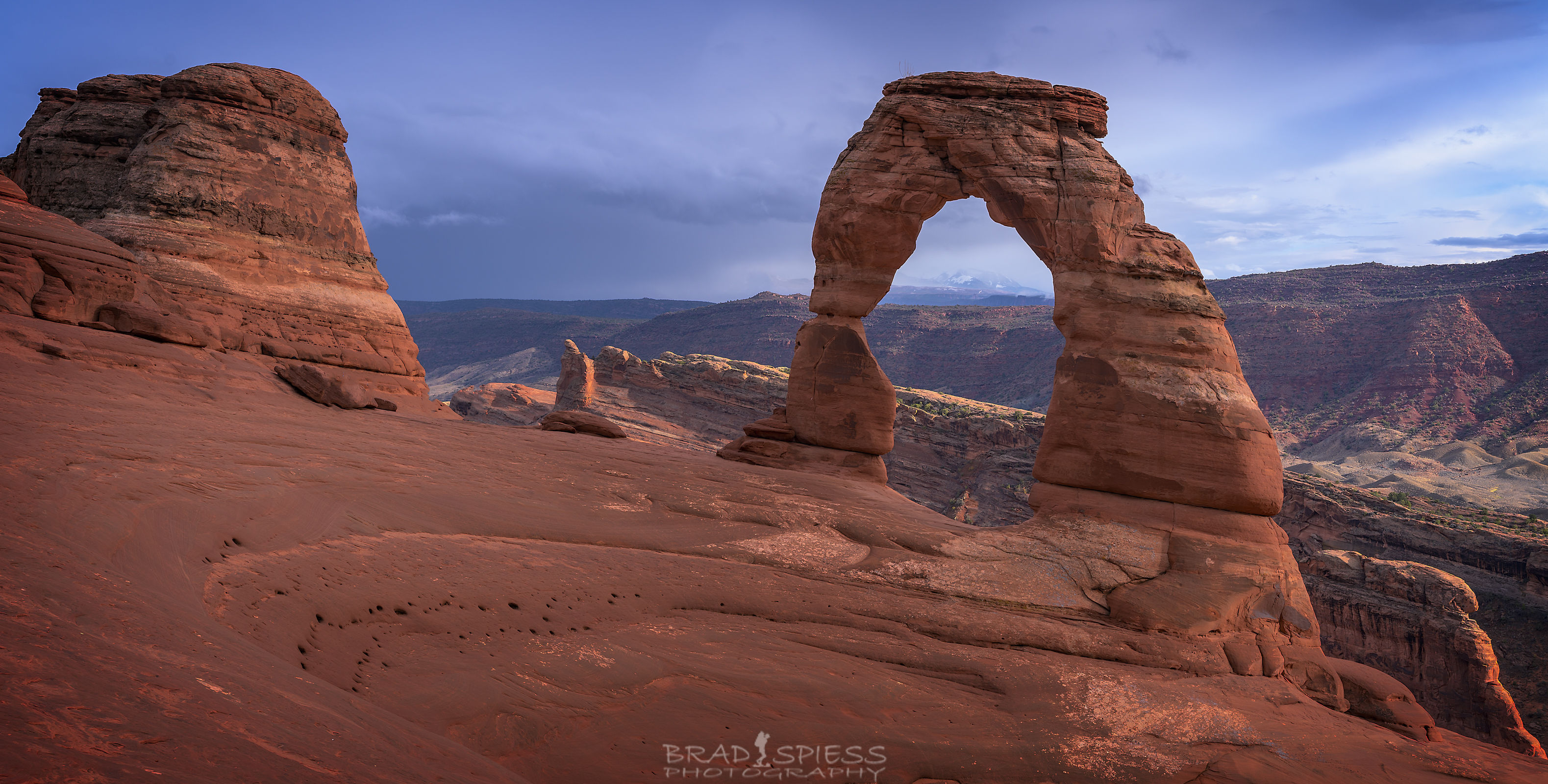 Looking through the Delicate Arch during sunset at Arches National Park