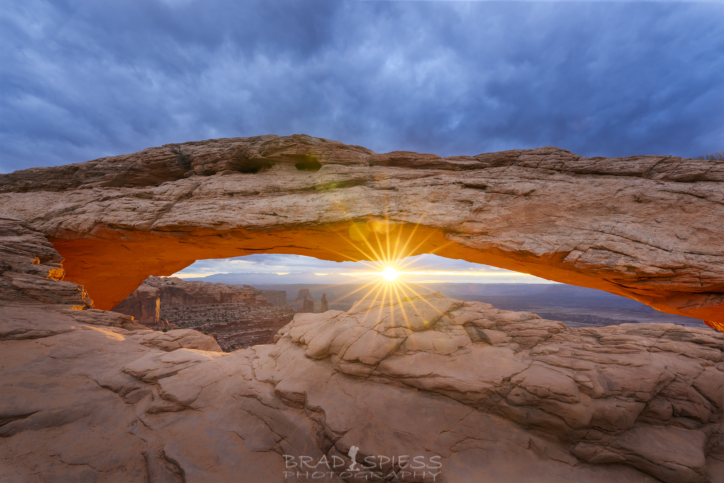 The sun lighting up the underside of Mesa Arch