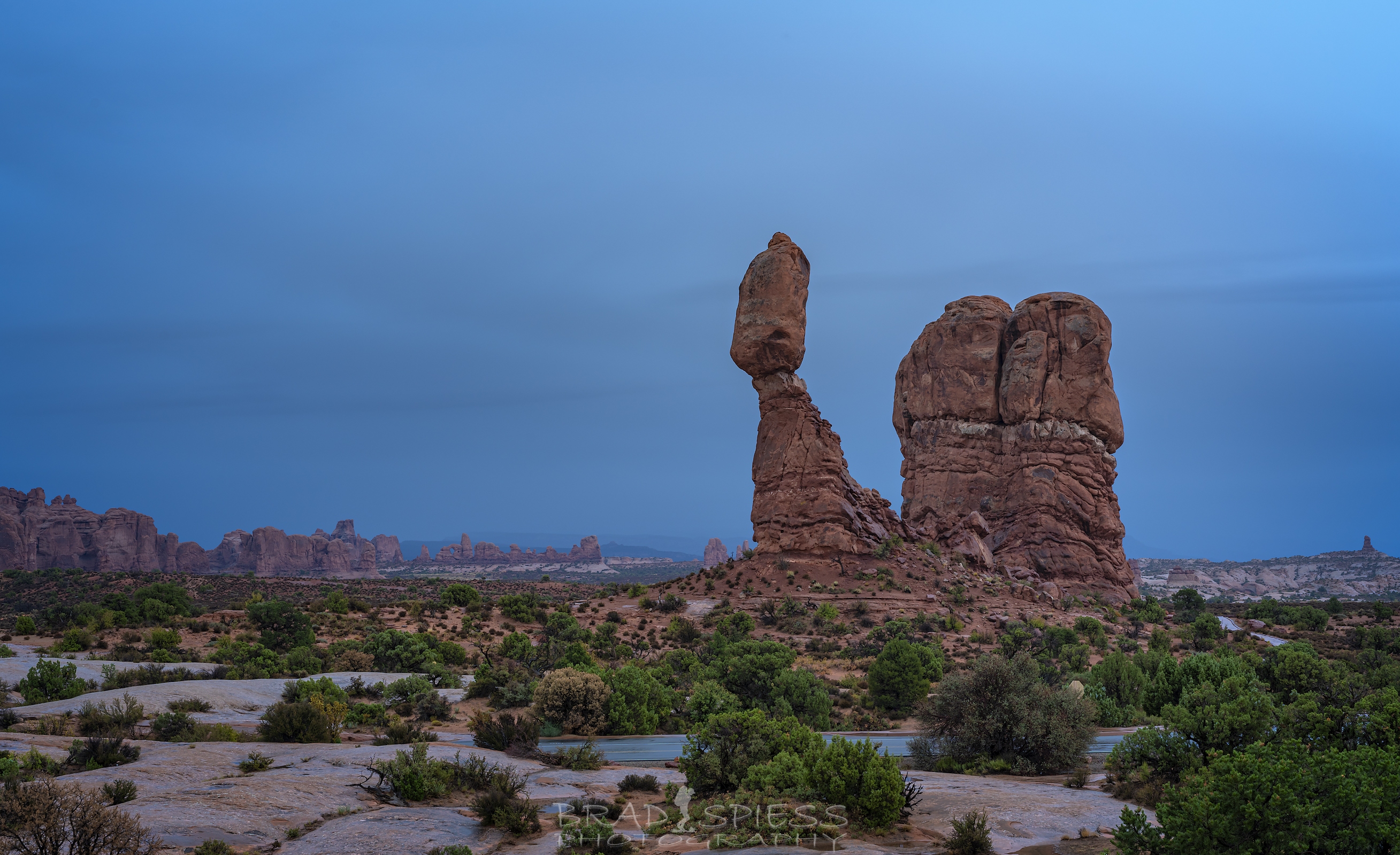 The stormy skies behind a wet Balanced Rock
