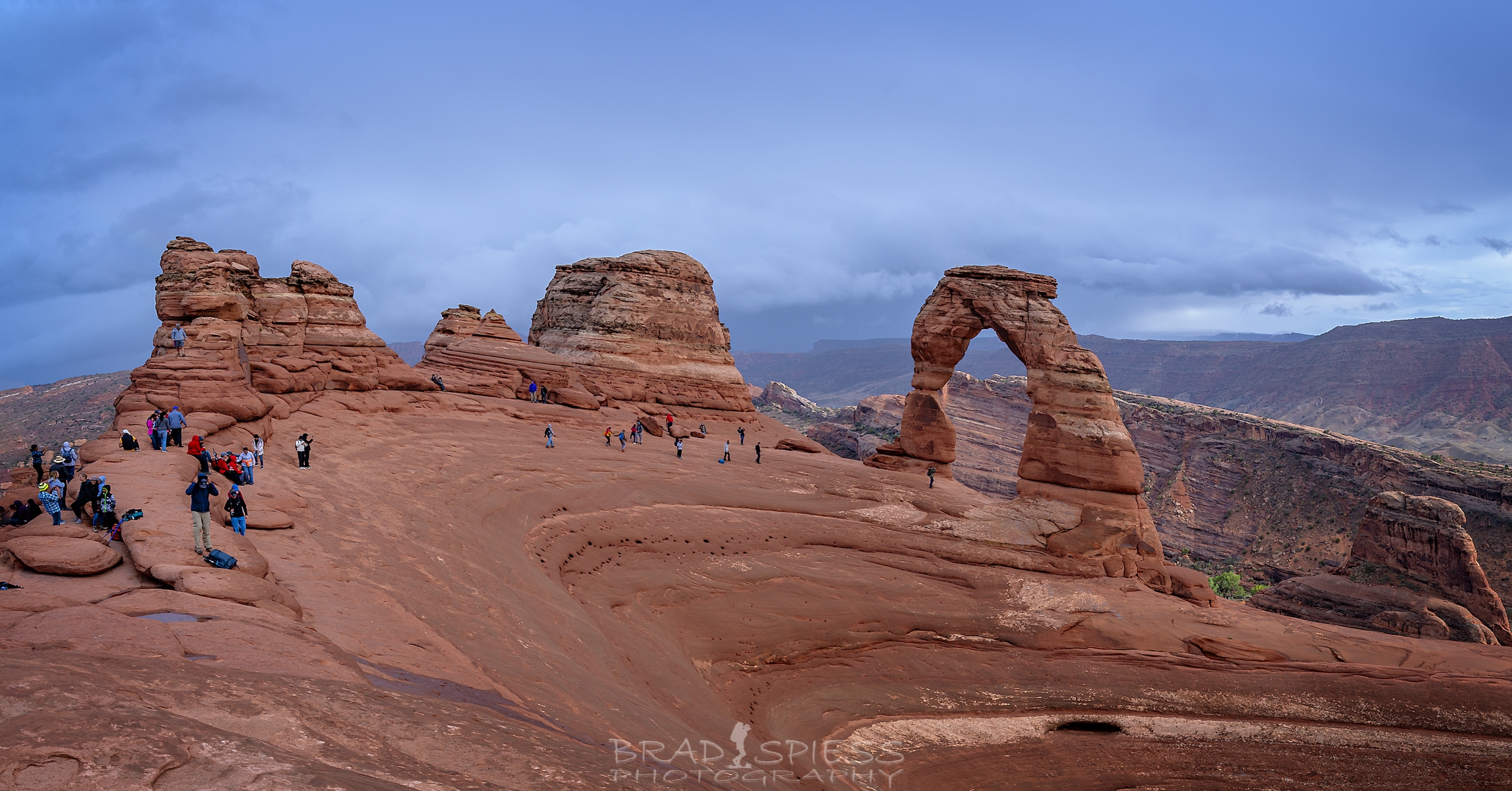 The crowds of people at Delicate Arch in Arches National Park