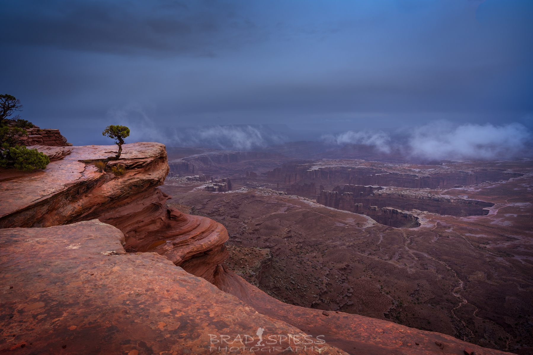 The clouds finally lifted giving us a clear view of the valley below at Grand View point in Moab.