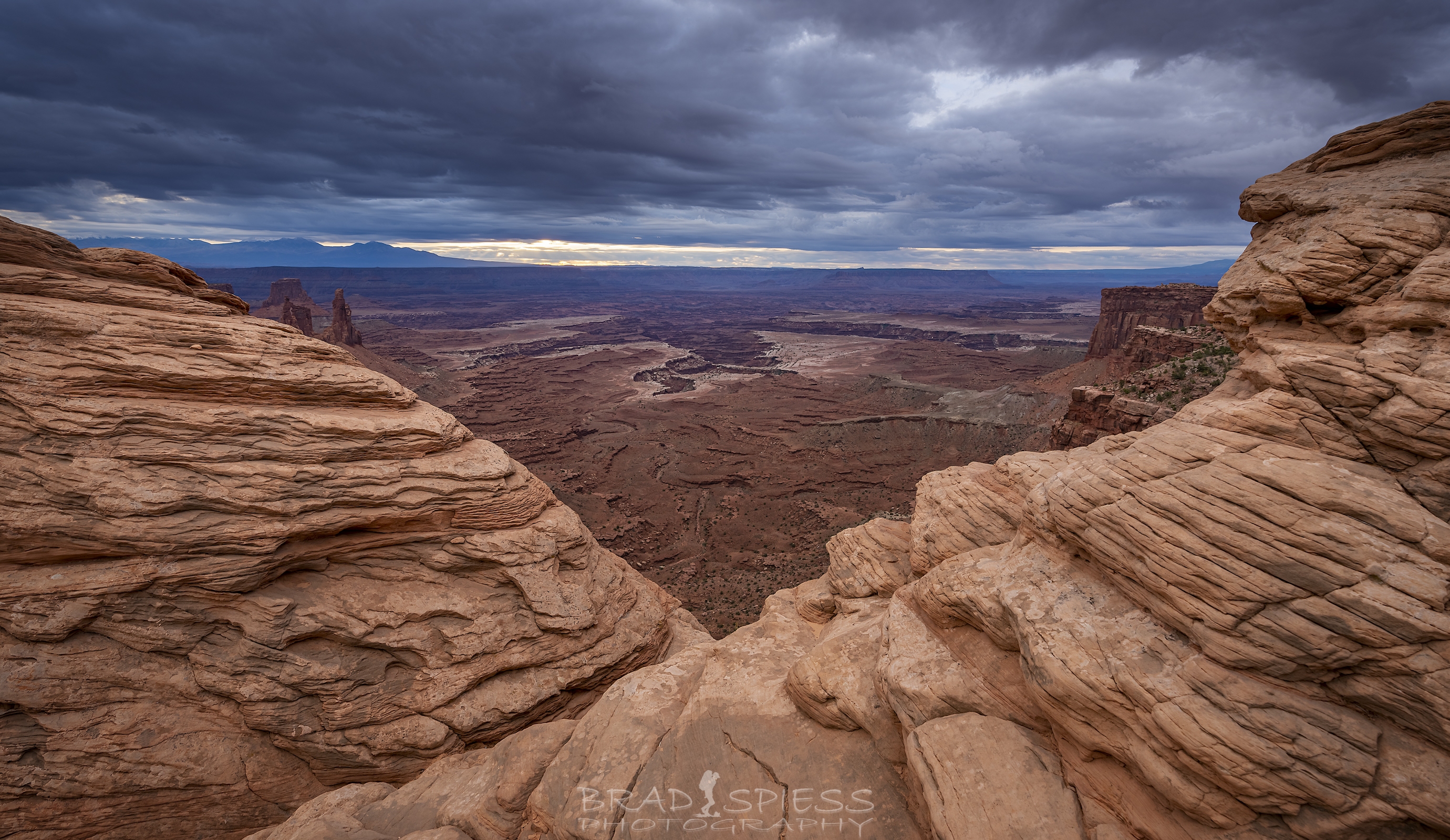 An area to the right of Mesa Arch gives a great glimpse of the canyons below.