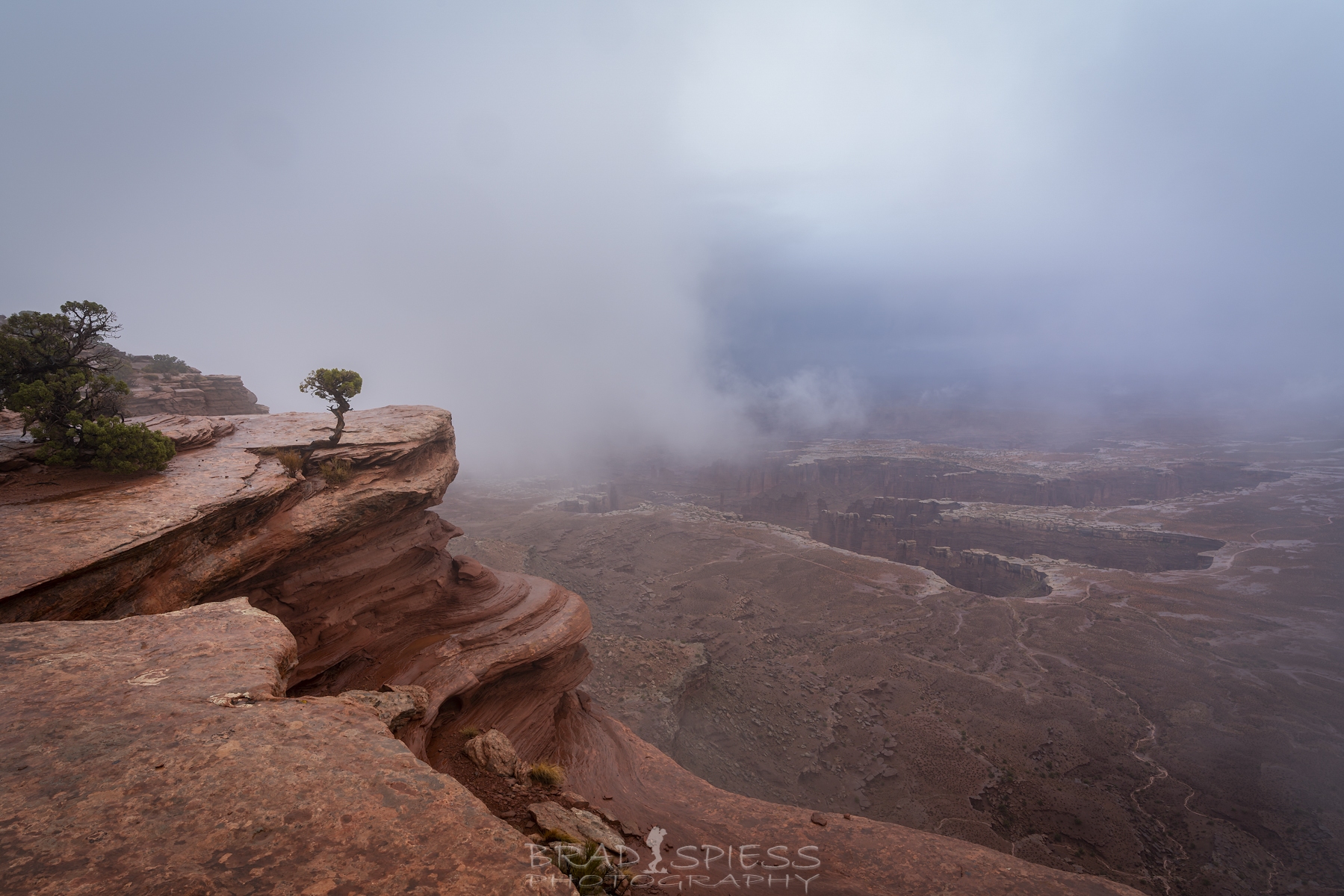 Clouds starting to lift at Grand View Point in Moab after a rainy morning.