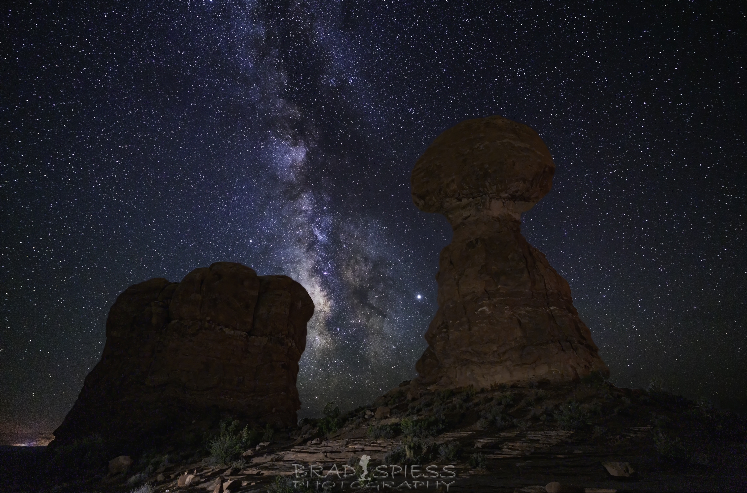 Milky Way rising between the rock columns of Balanced Rock in Moab Utah. 