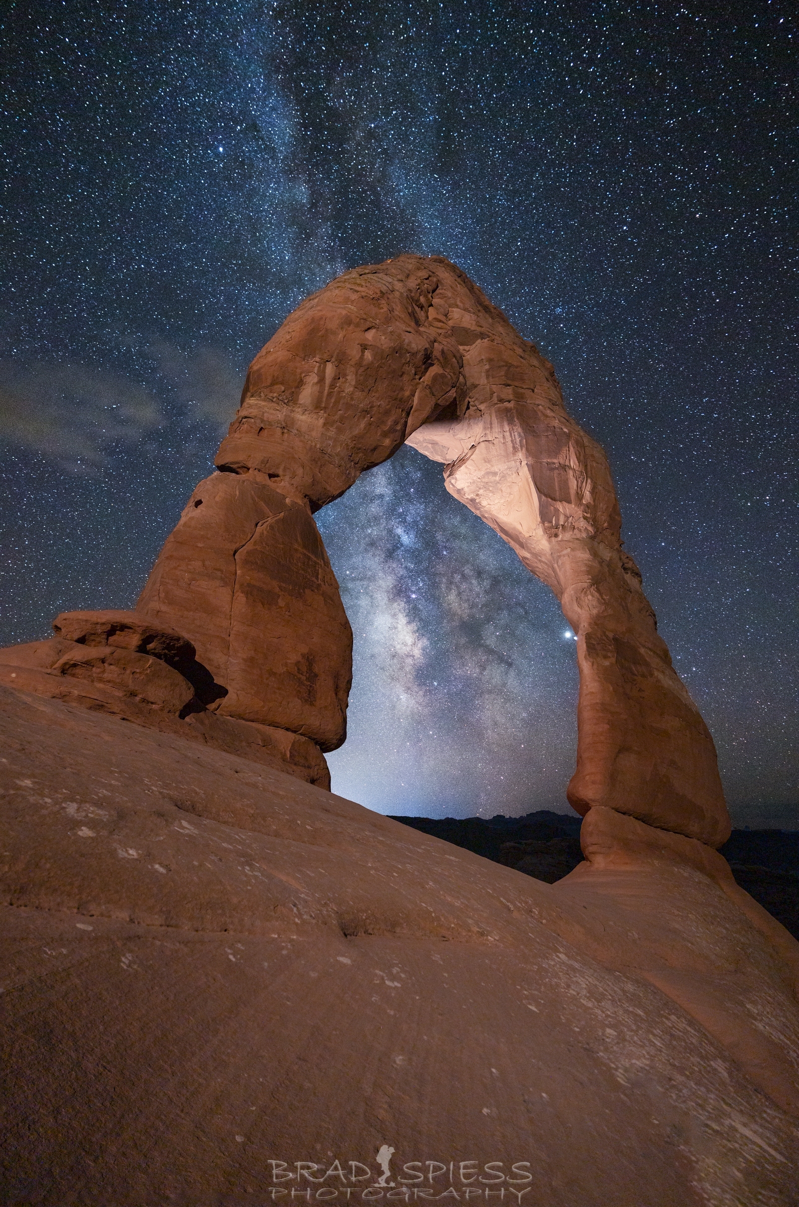 The Milky Way rising up behind Delicate Arch in Arches National Park