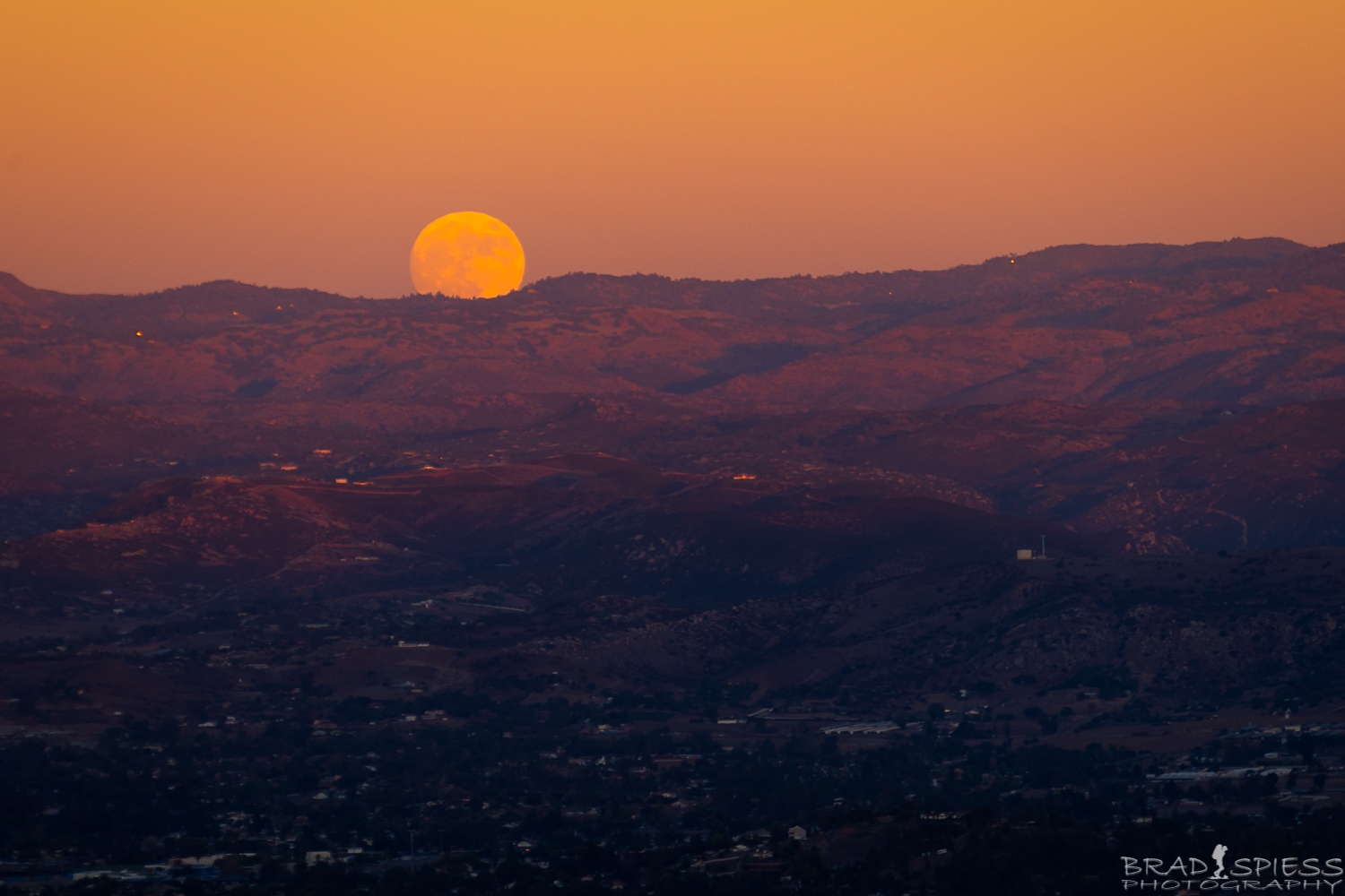Full Moon rising during sunset shot at 210 mm