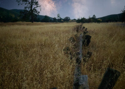 The dry grass surround an old wooden fence as it stretch's out towards the Milky Way in the San Diego Cuyamaca Mountains.